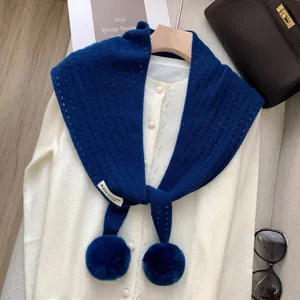 Detailed texture of royal blue wool scarf showing 8% cashmere and 92% wool blend composition