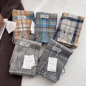 Classic British plaid wool scarves in multiple colors with tassels and branded labels