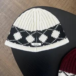 Close-up of 100% wool knit bucket hat featuring classic Nordic diamond patterns