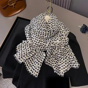 Beige cotton linen feel scarf with black heart print and gold foil details for women