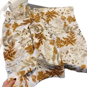 Bohemian linen cotton leaf print scarf in creamy white and gold for travel styling