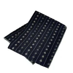 Navy blue winter cotton scarf with white snowflake patterns and striped hem details