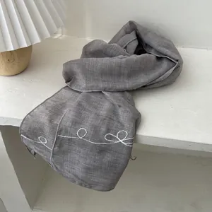 Gray lightweight vintage scarf with artistic white line embroidery and rolled edges