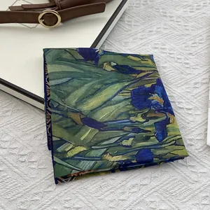 Detail of artistic square scarf with Van Gogh iris oil painting print on silk texture