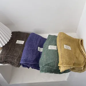 Set of four textured cotton linen scarves in brown, purple, green, and yellow hues
