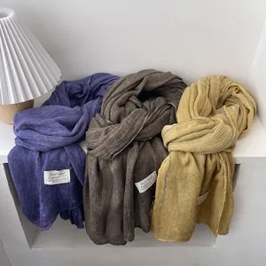 Soft cotton linen knit scarves in purple, brown and yellow with texture and woven labels