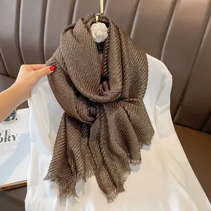 Luxe pleated gold-flecked brown cotton linen scarf with elegant fringe and metallic shimmer