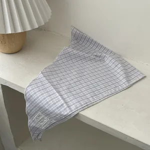 Vintage checkered triangular silk scarf with delicate hem and a decorative fabric label