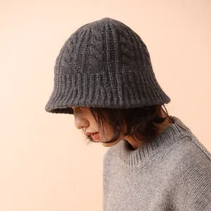 Deep grey merino wool cable knit bucket hat for women in a stylish autumn winter look