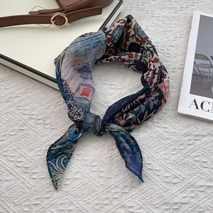 Detailed shot of retro printed silk scarf with elegant scrollwork and vintage patterns