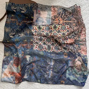 Detail of vintage patchwork silk scarf with bird patterns and retro letter printing