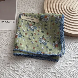 Floral print green cotton silk scarf with blue lace trim and explore infinity label