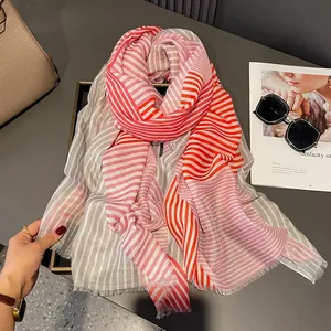 Elegant lightweight striped scarf with fringe tassels in red and grey for summer protection