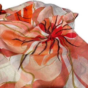 Lightweight tropical floral print scarf with bright orange and red botanical patterns