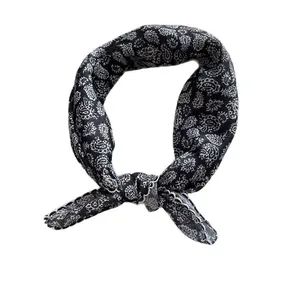 Elegant black and white paisley floral silk scarf square tied in a stylish ring knot