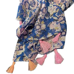 Navy floral bohemian shawl with pink and orange tassels on lightweight fabric