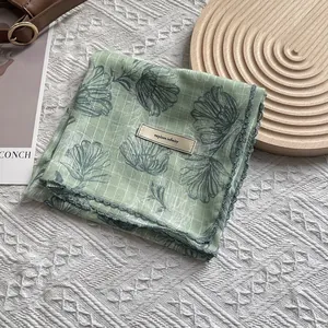 Floral green cotton linen scarf with plaid patterns and elegant crochet lace trim detail