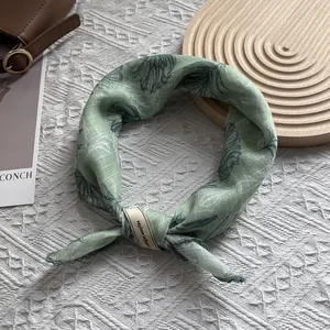 Light green cotton linen square scarf with feather prints and explore infinite tag