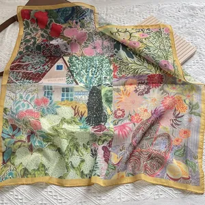 Detail of floral silk scarf featuring pastoral house and lemon prints on lace
