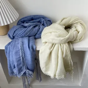 Elegant cotton linen scarf with lace edges in light blue and beige colors for women