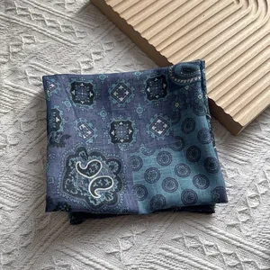 Detail of blue paisley cotton linen scarf showing ethnic patterns and soft texture