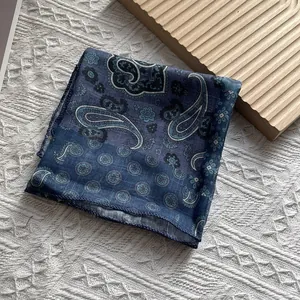 Detail of navy blue paisley cotton linen scarf with high-quality stitched edges