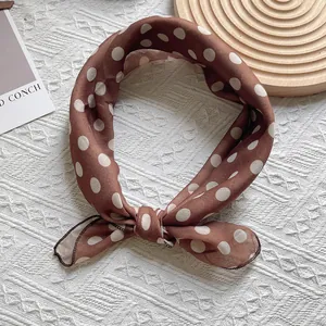 Brown polka dot silk scarf for women featuring a retro design on a textured surface