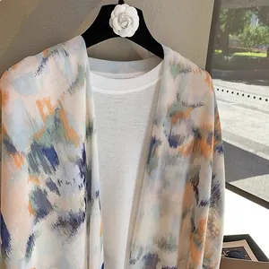 Artistic gradient ink wash cotton linen scarf worn as a lightweight summer shawl