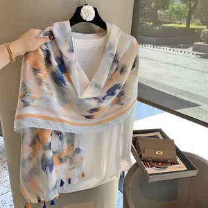 Detailed texture of lightweight cotton-linen scarf with ink painting and tassel fringe
