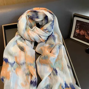 Artistic watercolor cotton linen scarf with gradient blue and orange abstract patterns