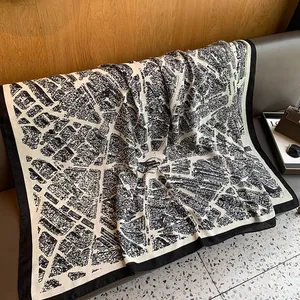 Detailed view of large black and white vintage city map printed cotton linen scarf