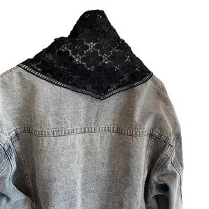 Black floral crochet cotton shawl lace neck scarf displayed on denim jacket