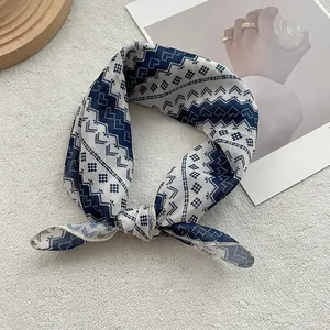 Close-up of a blue and white patterned cotton necktie tied in a stylish bow knot