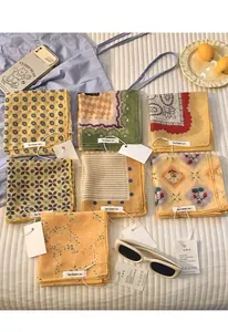 Flat lay of colorful floral and patterned cotton linen scarves with be keen on labels