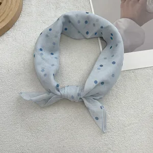 Light blue polka dot square scarf made of soft linen-cotton fabric for elegant styling