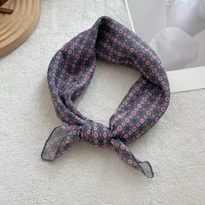 Detail of floral cotton linen neckerchief with retro pattern in grey blue and red