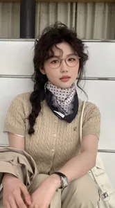 Polka dot lace scarf and round glasses styled on model in knit short sleeve top