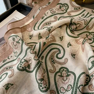 Elegant paisley print scarf in cream and green, lightweight shawl for spring and winter