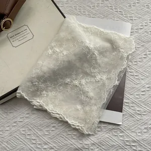Elegant white lace scarf with floral embroidery and wavy edges for women in classic style