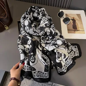 Elegant black and white camellia floral print scarf in soft lightweight fabric for women