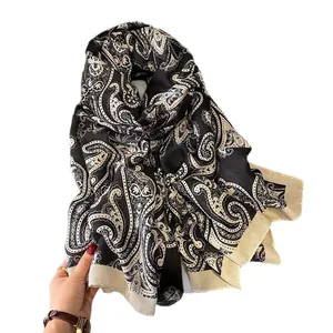 Elegant black and cream paisley silk scarf for women featuring a lightweight draped design