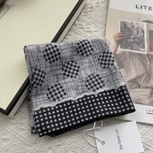 Soft black and white checkered 80-yarn scarf with elegant dot patterns and gift tag