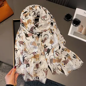 Detailed view of lightweight cat print scarf with frayed edges on a stylized background