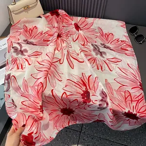 Detail of red floral print on breathable cotton linen scarf with soft draping effect