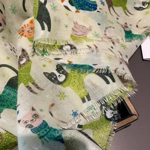 Close-up of cat paradise print scarf showing fine texture and winter snowflake patterns