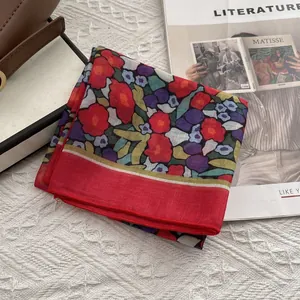 Close-up of floral cotton linen square scarf with red border and vintage print