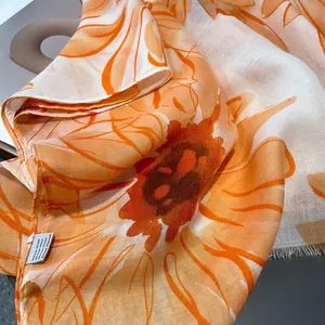 Detailed macro view of vibrant sunflower cotton-linen scarf with delicate fringed edges