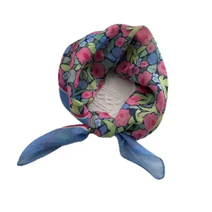Floral print linen cotton square scarf with blue trim and delicate floral pattern