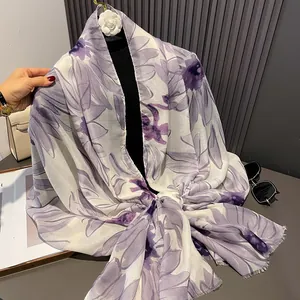 Detail showing the lightweight purple floral pattern fabric and delicate frayed edges
