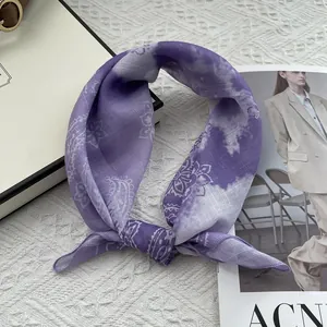 Detail view of cotton linen square scarf with purple paisley pattern and tie-dye texture